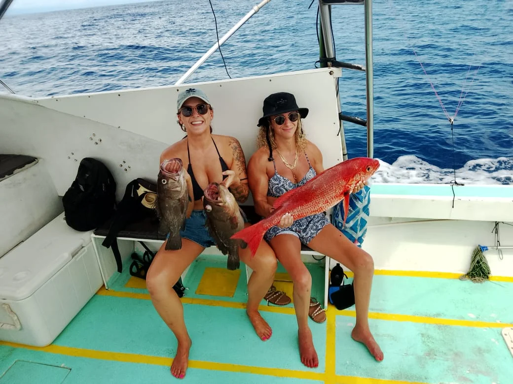Two women anglers with snapper and grouper after a fishing trip near Jaco Costa Rica in August 2026