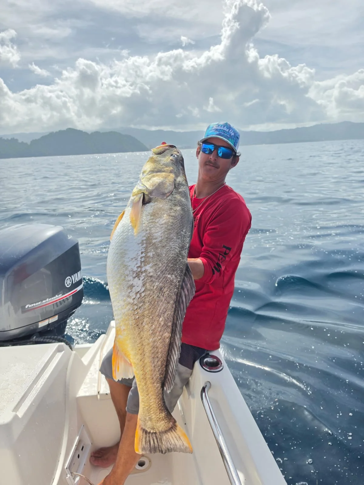 Angler holding a large trophy inshore fish caught near Jaco Costa Rica in August 2026