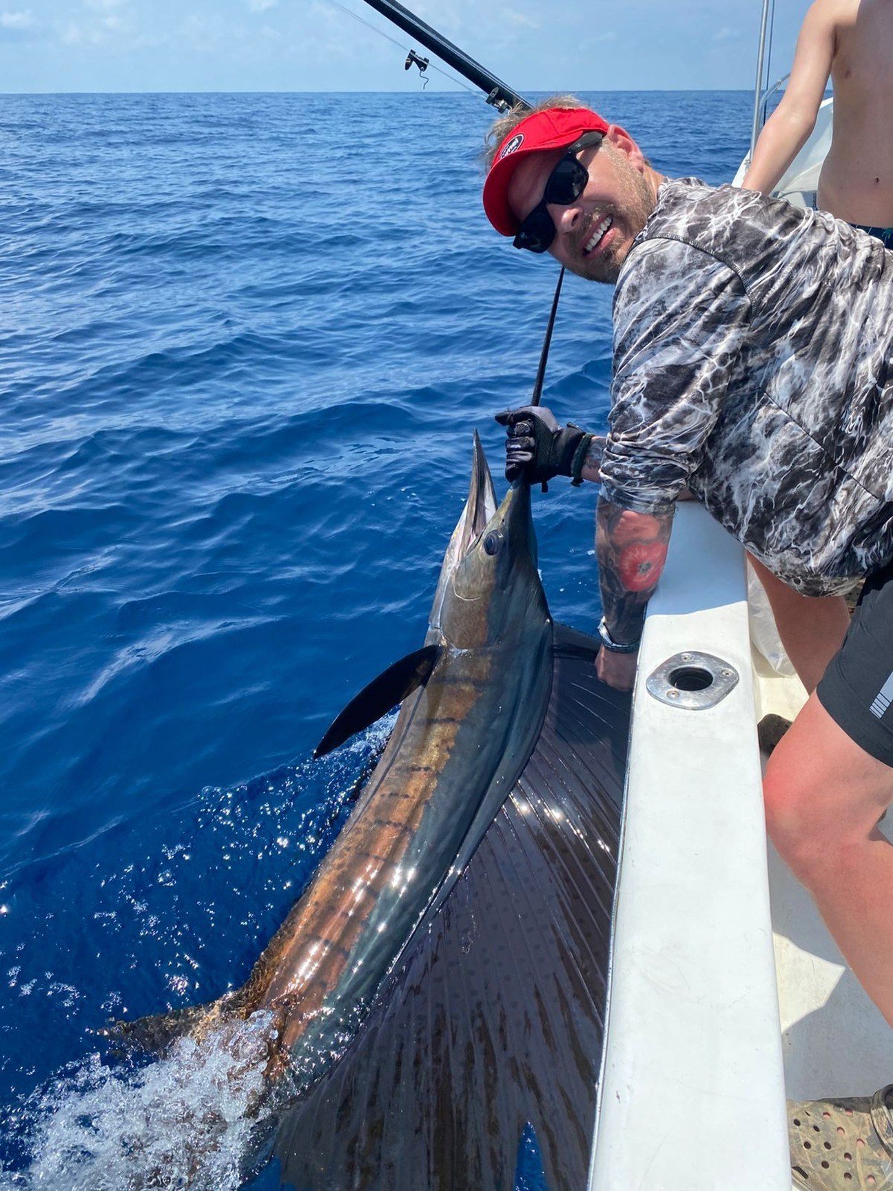 Sailfish Catch Jaco Costa Rica 4 Guest with sailfish during a Wahoo Sportfishing Jaco offshore fishing charter in Costa Rica