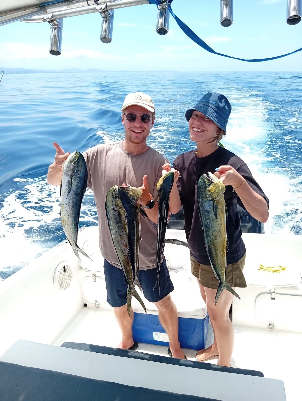 Guest with mahi mahi dorado during a Wahoo Sportfishing Jaco offshore fishing charter in Costa Rica