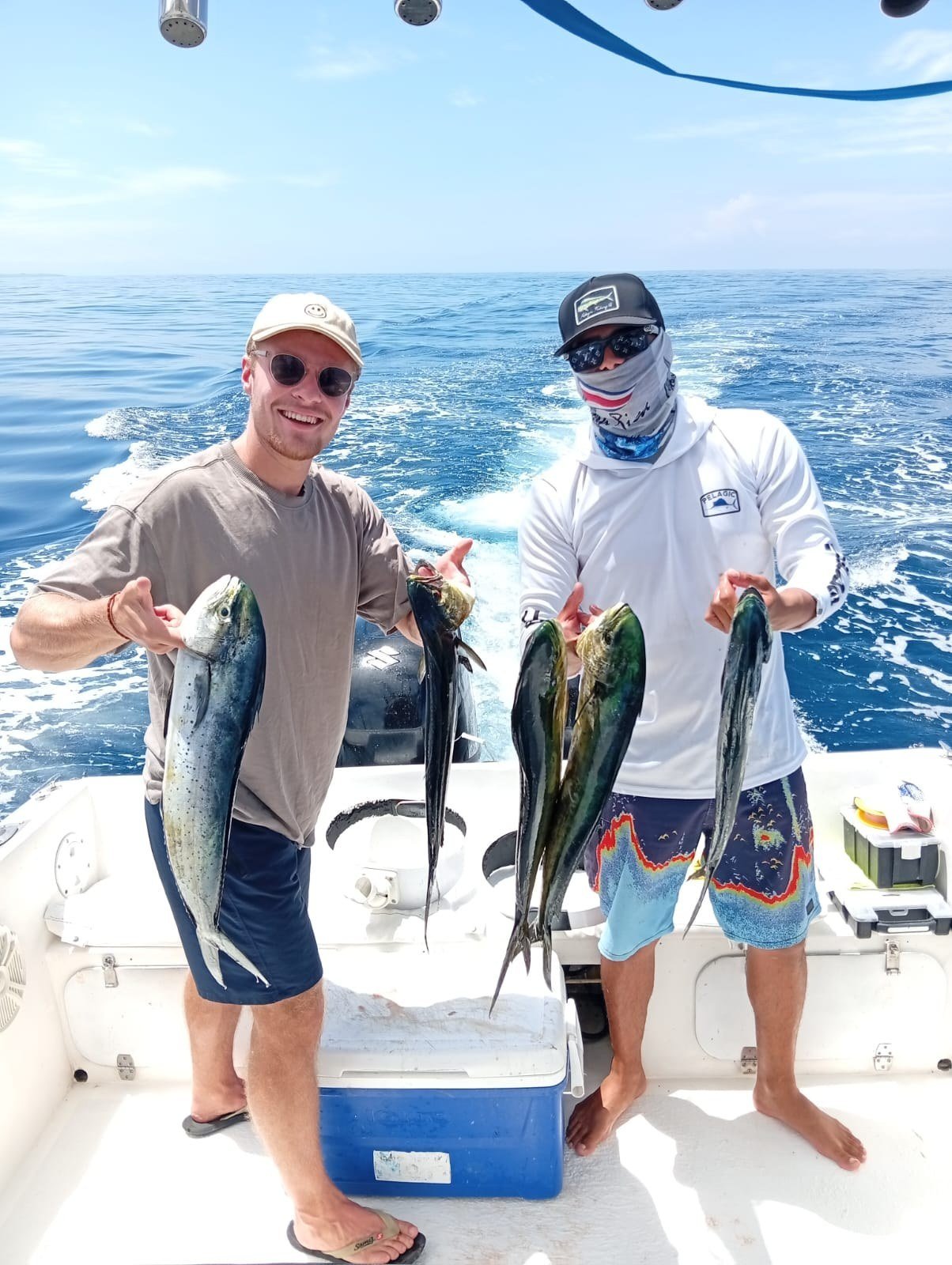 Guest with mahi mahi dorado during a Wahoo Sportfishing Jaco offshore fishing charter in Costa Rica