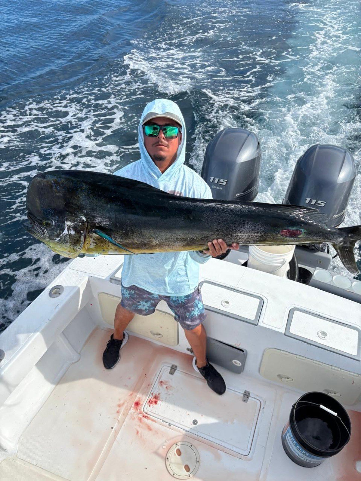Guest with mahi mahi dorado during a Wahoo Sportfishing Jaco offshore fishing charter in Costa Rica