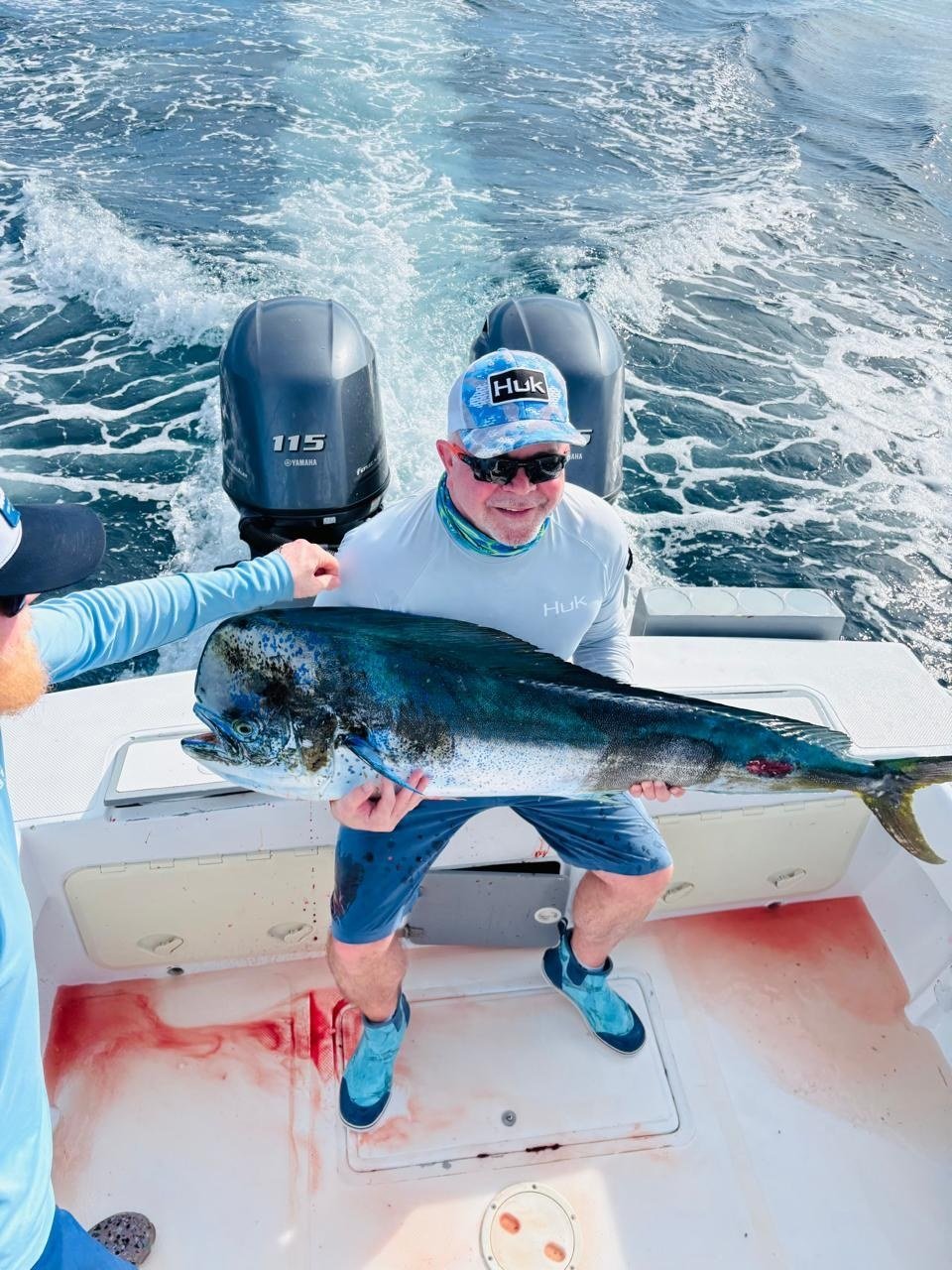 Guest with mahi mahi dorado during a Wahoo Sportfishing Jaco offshore fishing charter in Costa Rica