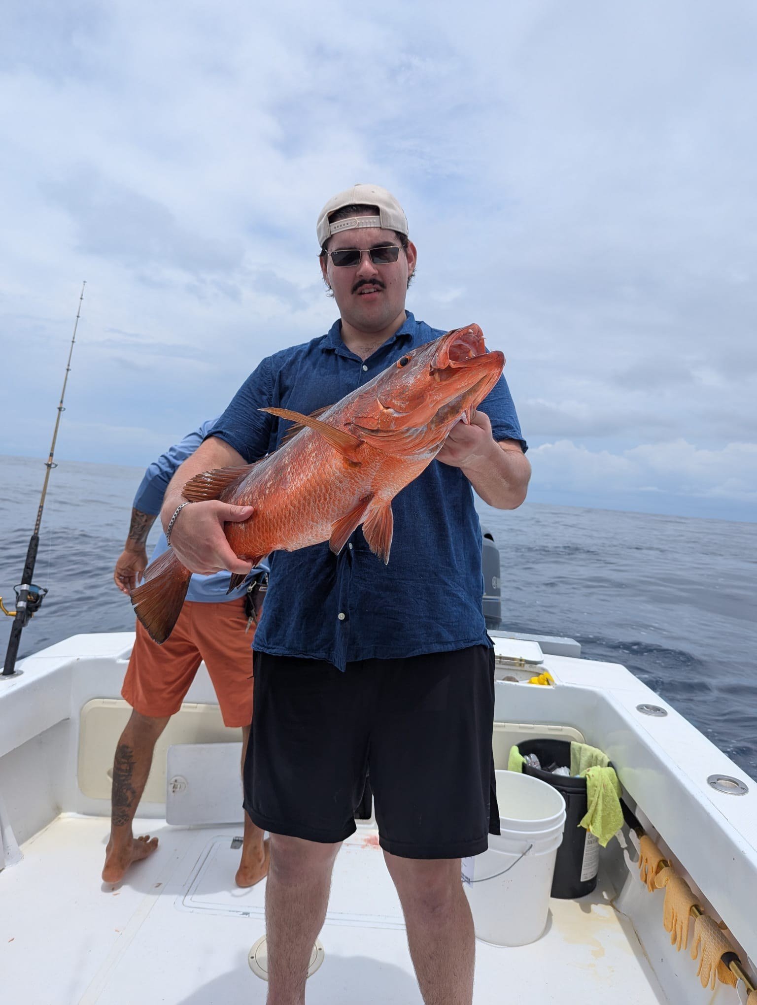 Guest with red snapper during a Wahoo Sportfishing Jaco fishing charter in Costa Rica