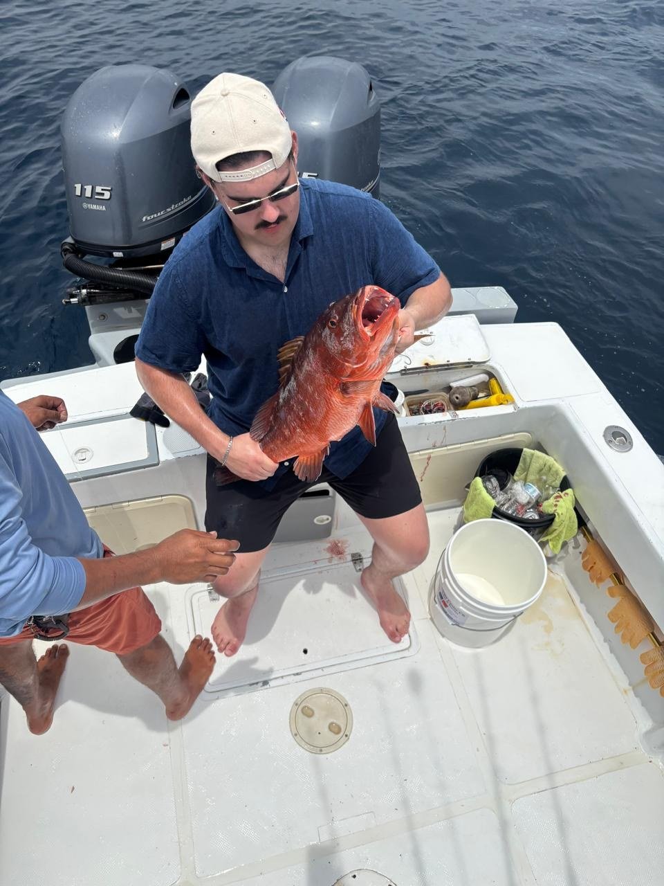 Guest with red snapper during a Wahoo Sportfishing Jaco fishing charter in Costa Rica