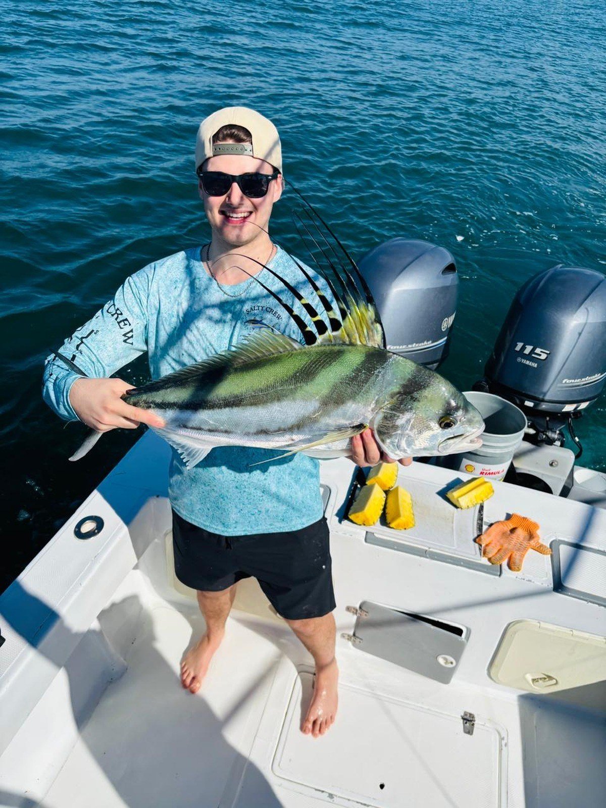 Guest with roosterfish during a Wahoo Sportfishing Jaco inshore fishing charter in Costa Rica