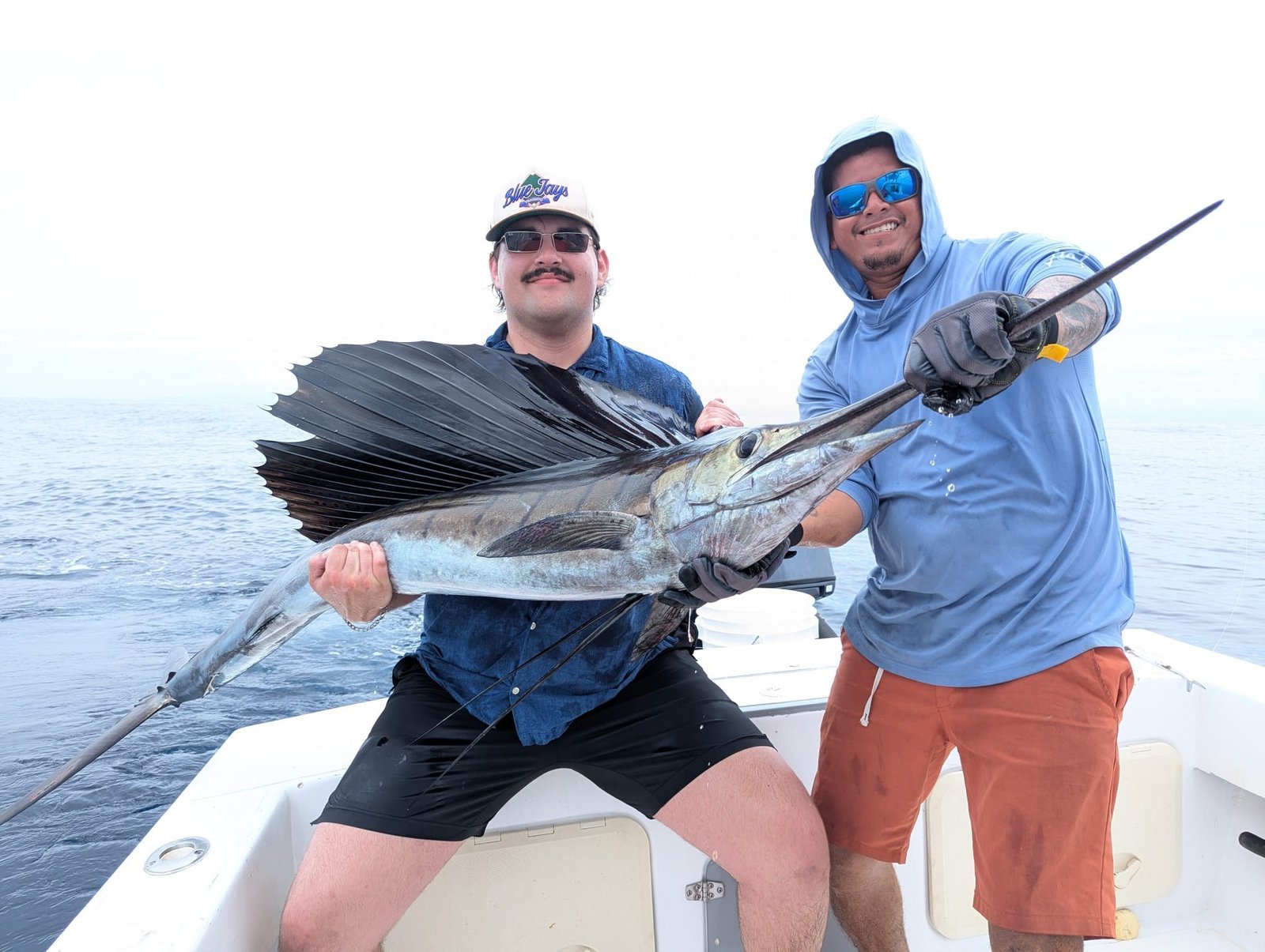 Guest with sailfish during a Wahoo Sportfishing Jaco offshore fishing charter in Costa Rica