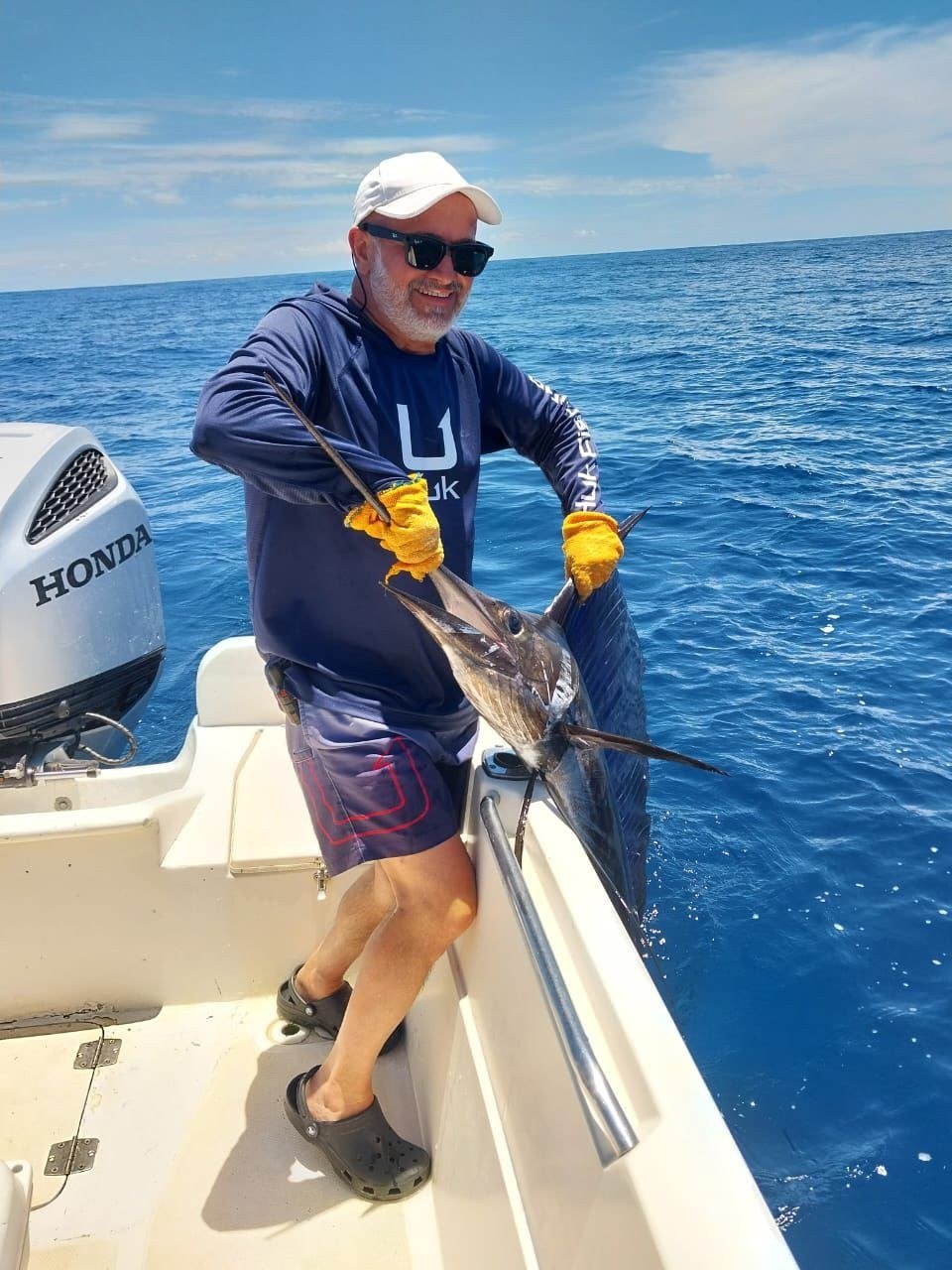 Guest with sailfish during a Wahoo Sportfishing Jaco offshore fishing charter in Costa Rica