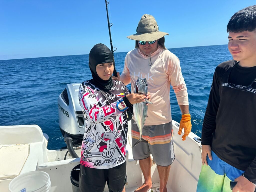 Family group with a tuna caught during an offshore fishing trip from Jaco Costa Rica in July 2026